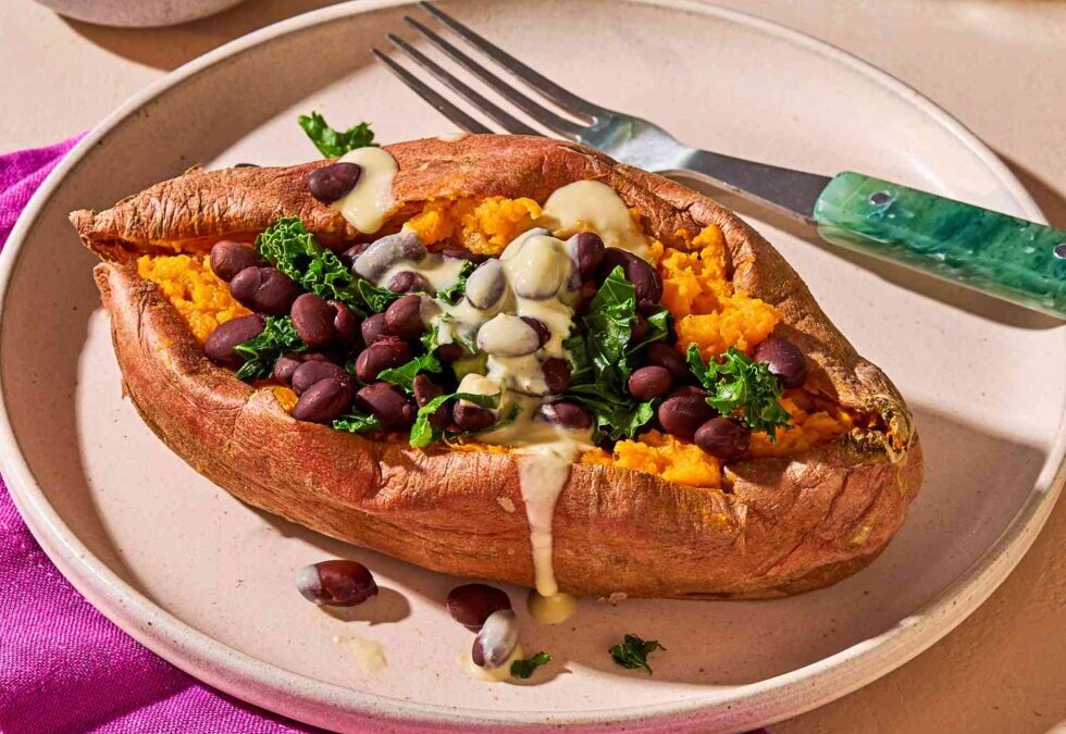 Stuffed Sweet Potatoes with Spiced Black Beans & Lime Crema
